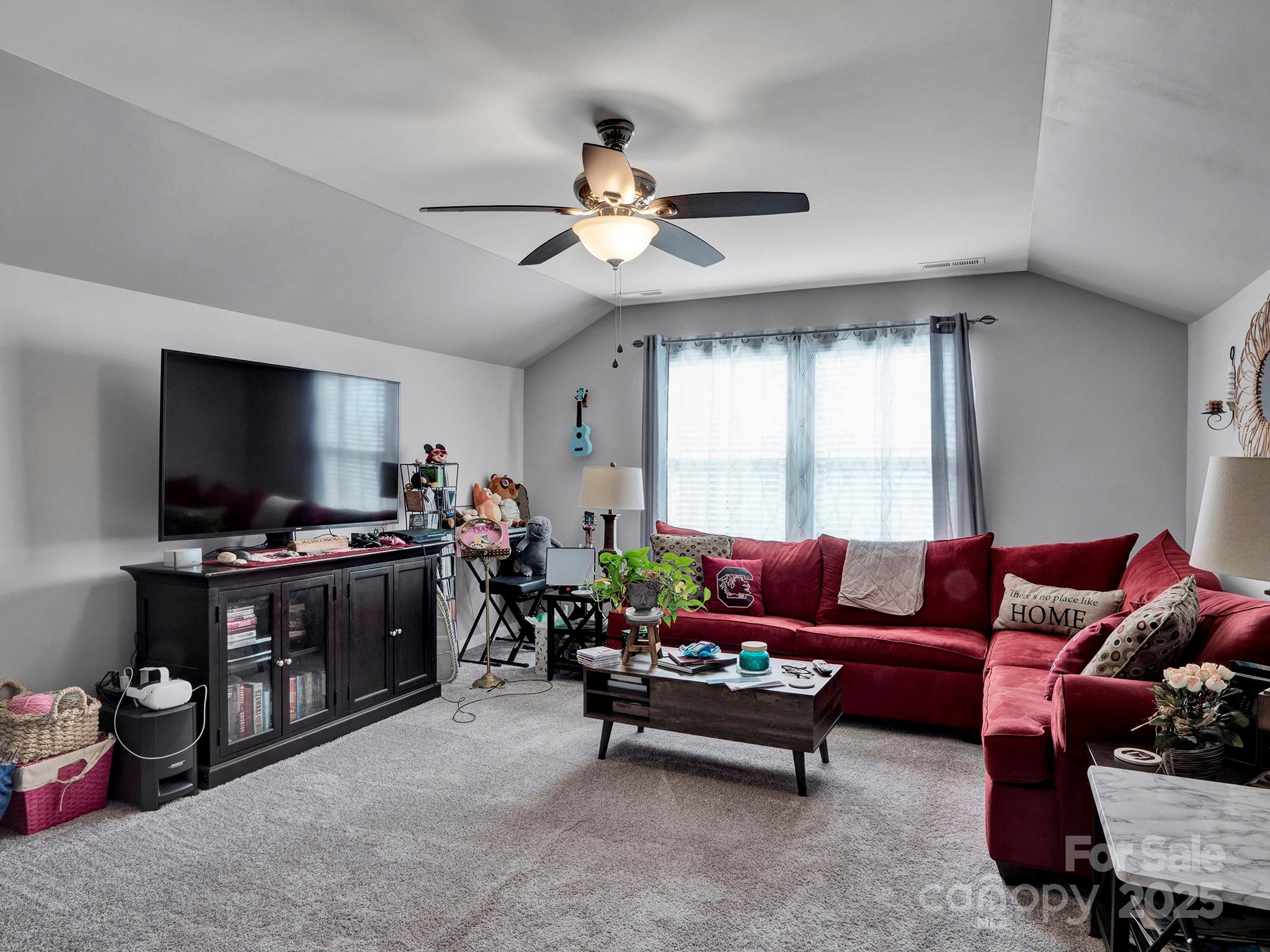 3129 Bridgewater Street, Unit 3E61 Lancaster, SC 29720 - Photo 35 of 48 a living room with furniture and a flat screen tv
