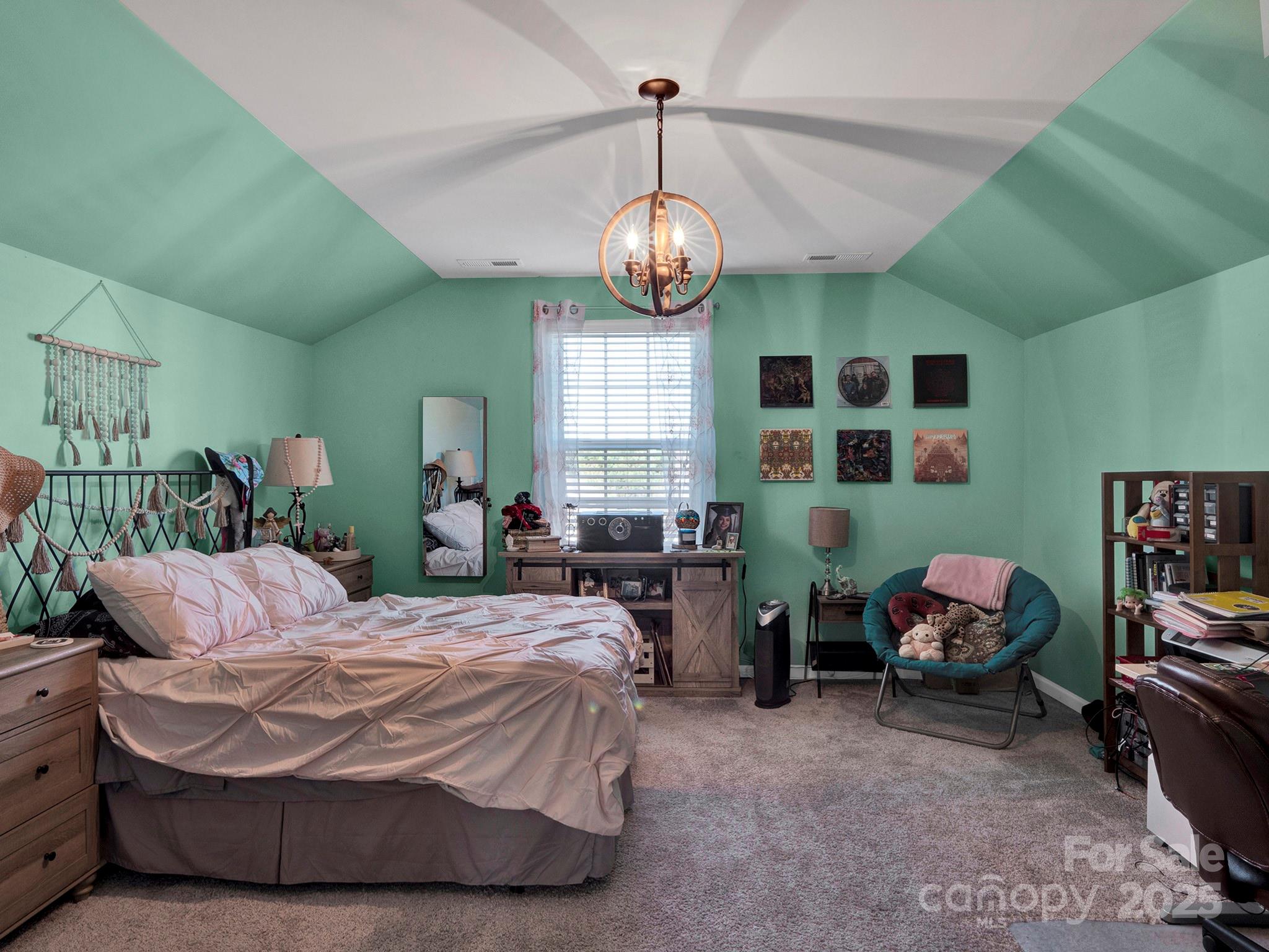 3129 Bridgewater Street, Unit 3E61 Lancaster, SC 29720 - Photo 36 of 48 a bedroom with a bed window and a chair