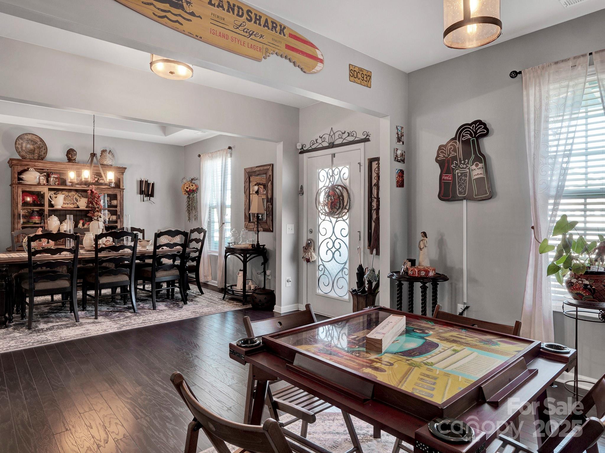 3129 Bridgewater Street, Unit 3E61 Lancaster, SC 29720 - Photo 4 of 48 a living room with lots of furniture and paintings on the wall