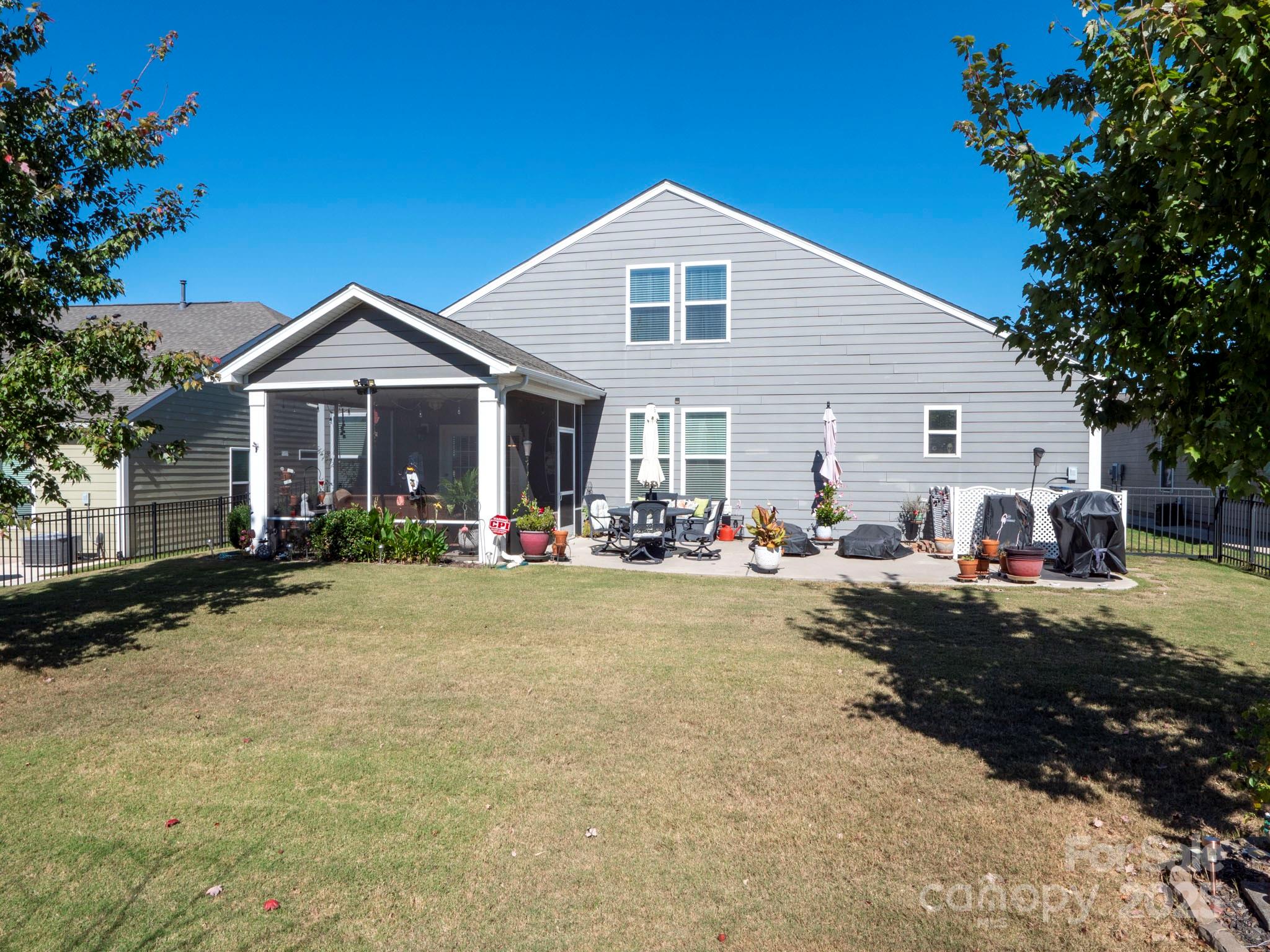 3129 Bridgewater Street, Unit 3E61 Lancaster, SC 29720 - Photo 45 of 48 a front view of a house with a yard and trees