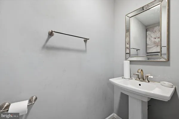 a bathroom with a sink and mirror