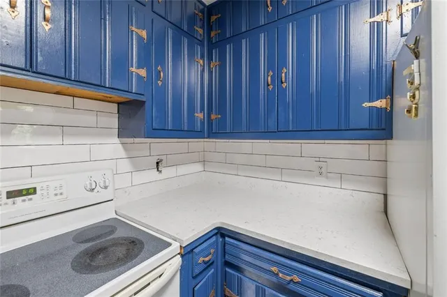 an aerial view of residential house with outdoor space and trees all around