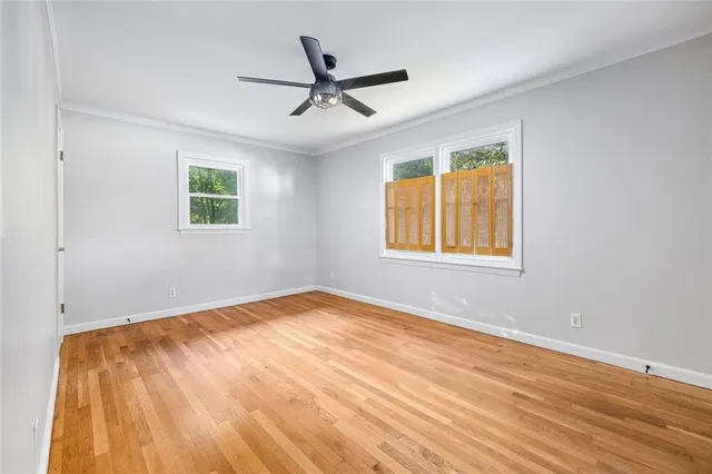 an aerial view of a house with a yard and lake view