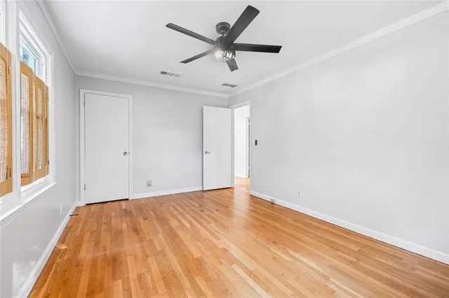 an aerial view of a house with a yard and lake view