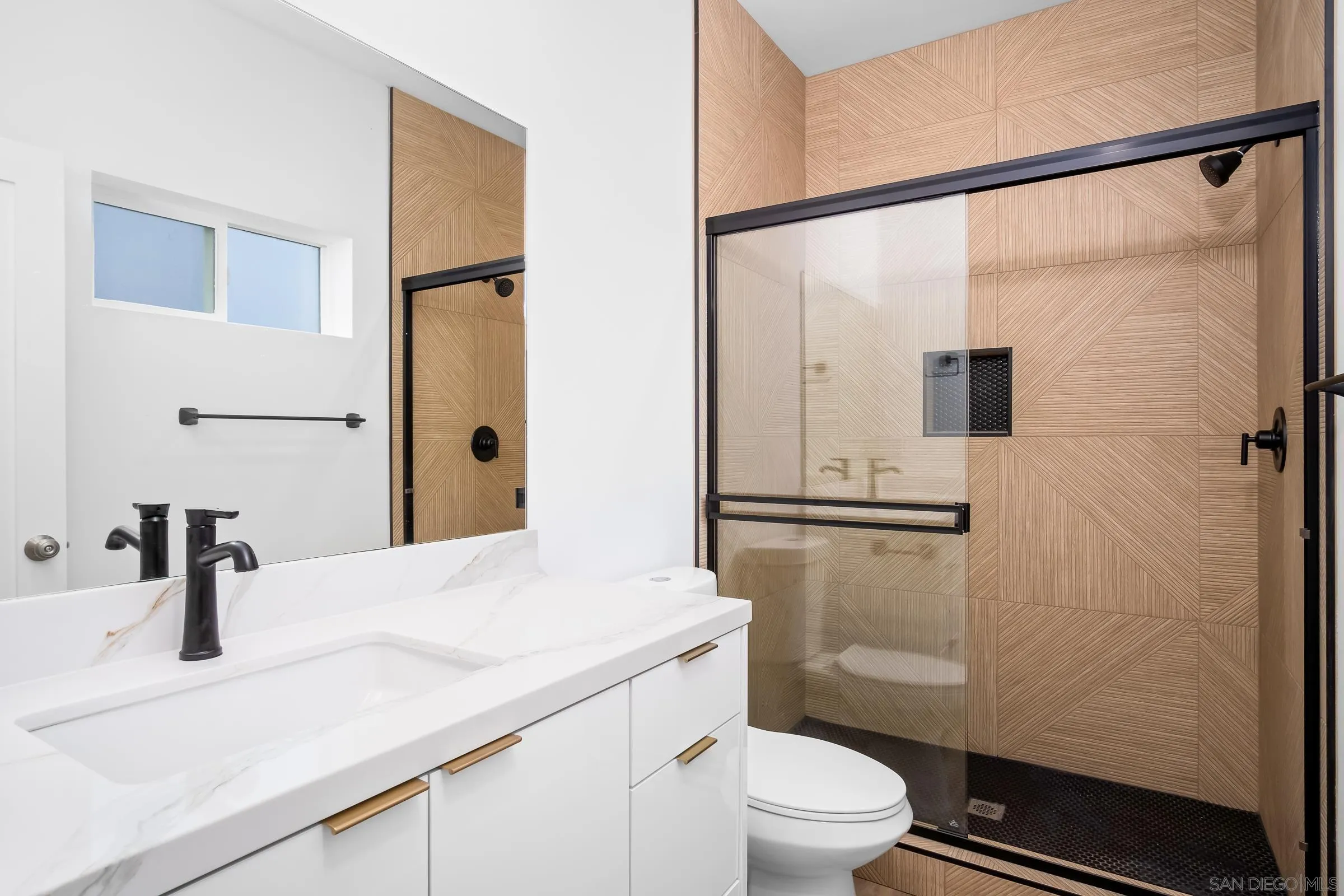 5230-32 Rincon Street San Diego, CA 92115 - Photo 15 of 29 a bathroom with a granite countertop sink toilet and shower