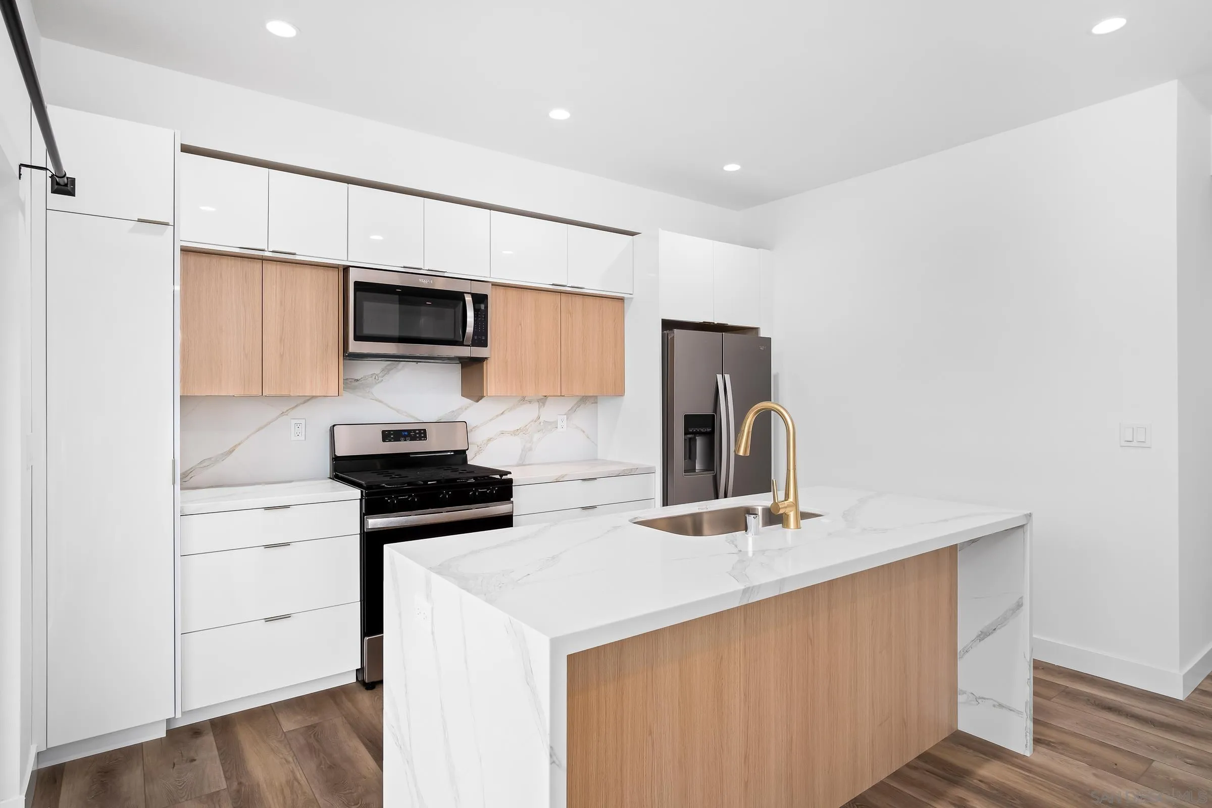 5230-32 Rincon Street San Diego, CA 92115 - Photo 8 of 29 a kitchen with stainless steel appliances a sink stove and refrigerator