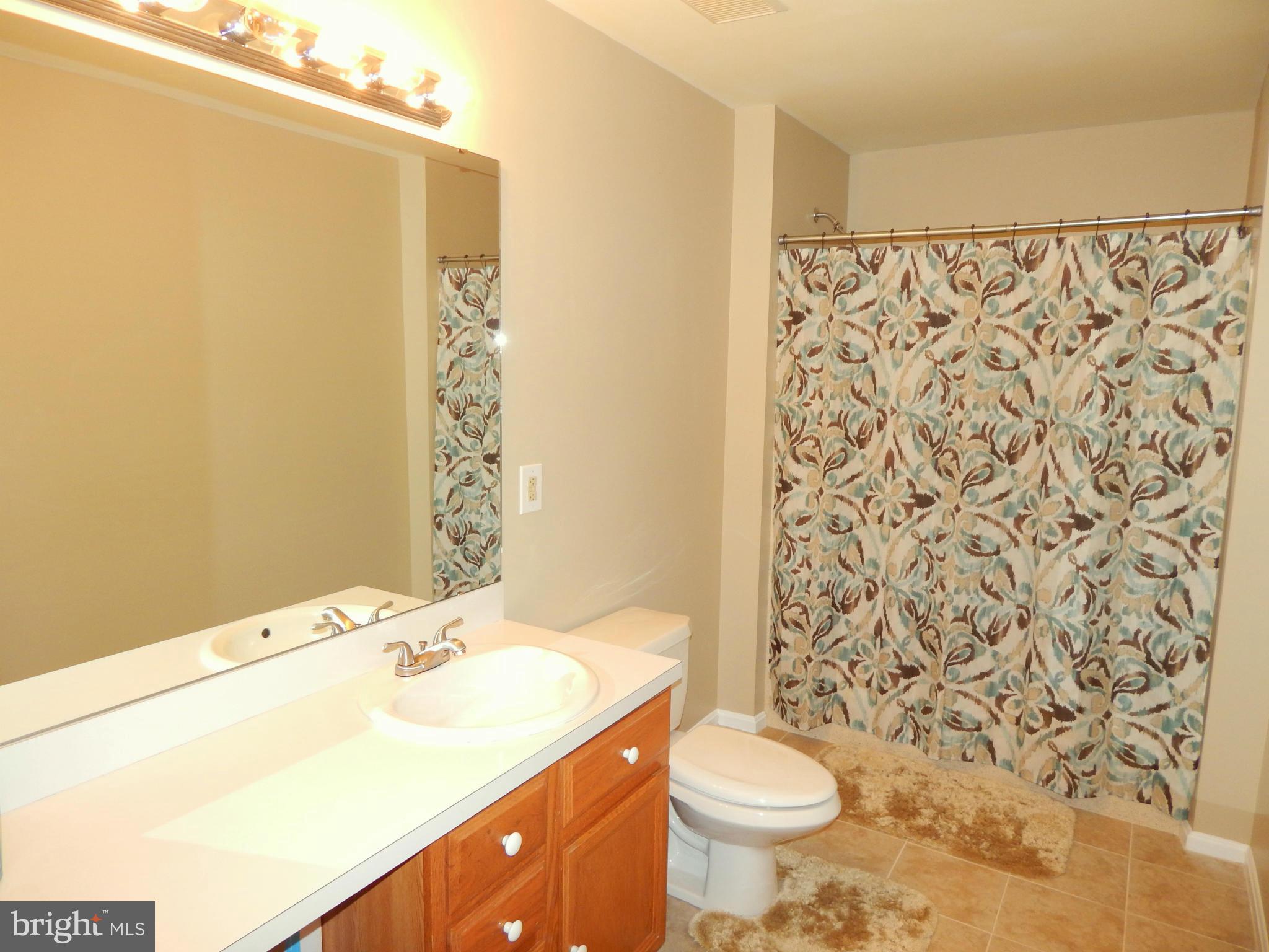 8246 Sinclair Mill Road Manassas, VA 20112 - Photo 14 of 30 Full Bathroom in Main Level Hallway