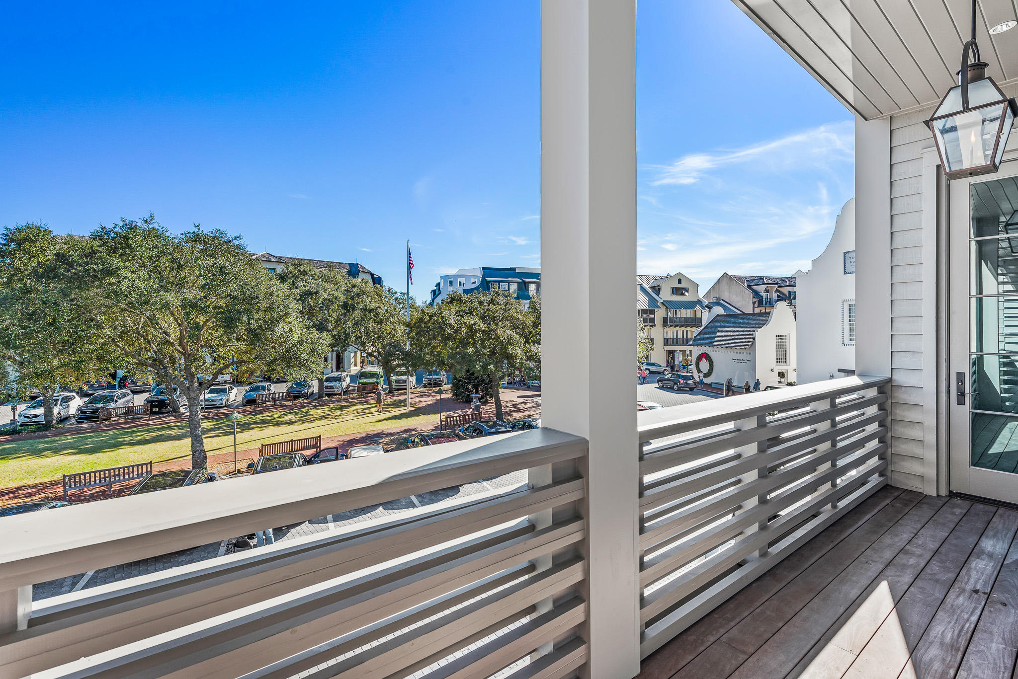 16 South Barrett Square, Unit 4 Inlet Beach, FL 32461 - Photo 31 of 98 a view of a balcony with floor to ceiling windows with wooden floor