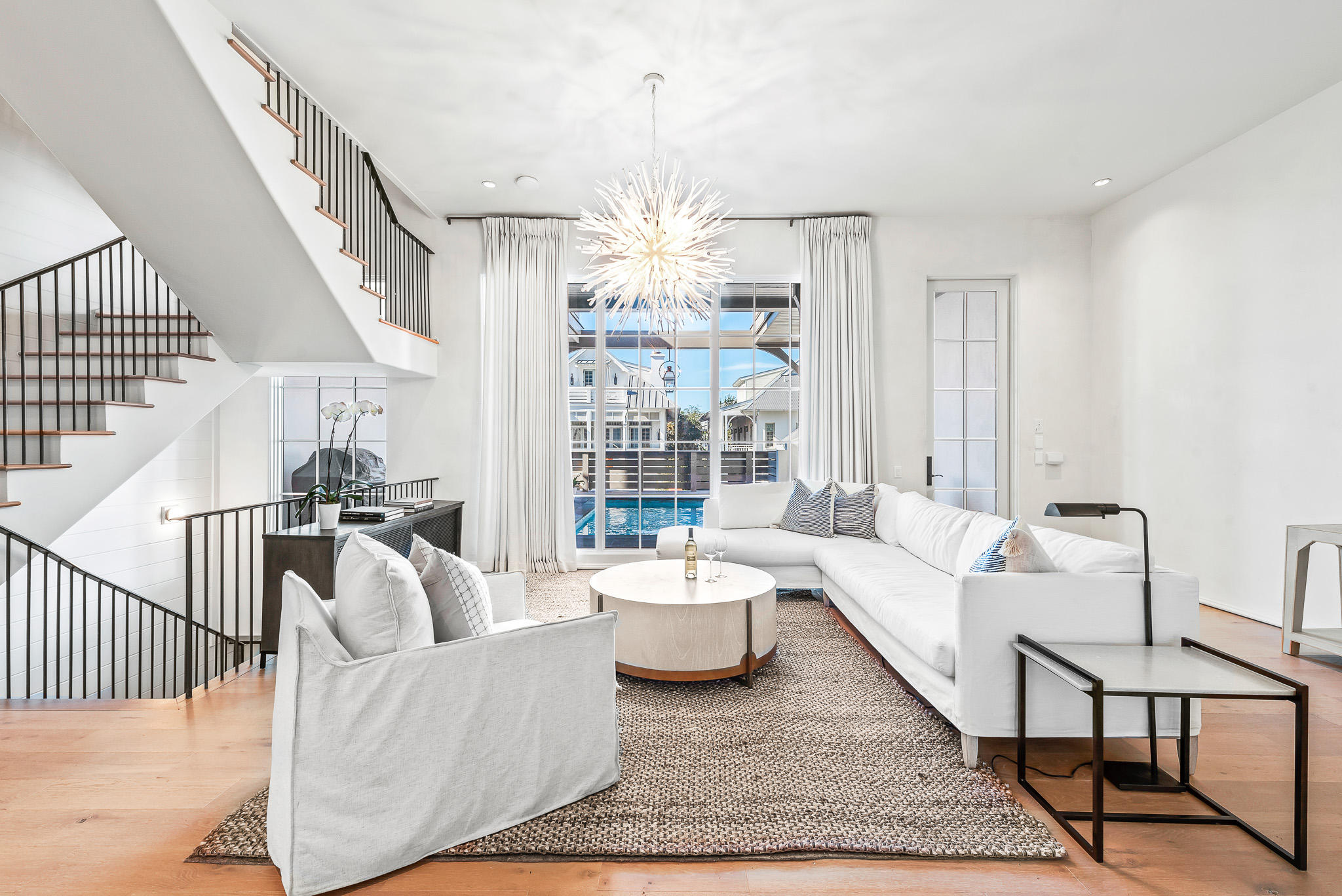 16 South Barrett Square, Unit 4 Inlet Beach, FL 32461 - Photo 6 of 98 a living room with furniture and a chandelier