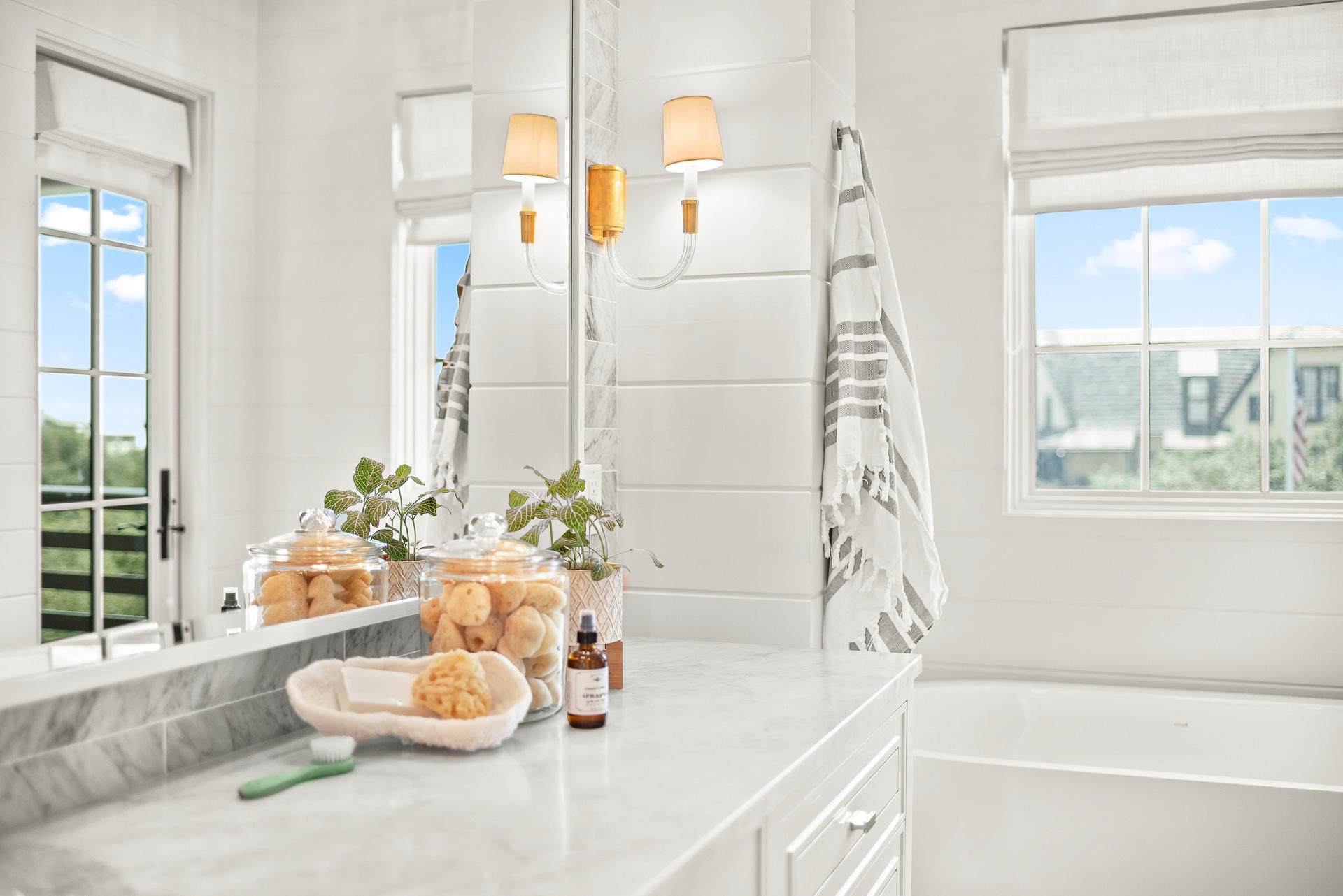 16 South Barrett Square, Unit 4 Inlet Beach, FL 32461 - Photo 61 of 98 a bathroom with a tub a potted plant and a large window