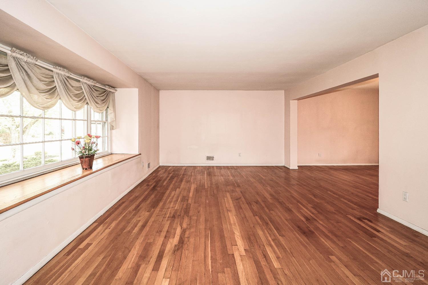 406 Plainfield Road Edison, NJ 08820 - Photo 8 of 41 a view of empty room with wooden floor and fan