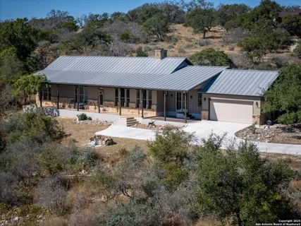 a backyard of a house with yard and outdoor seating