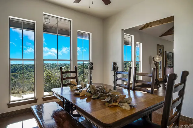 a view of a workspace with furniture and window
