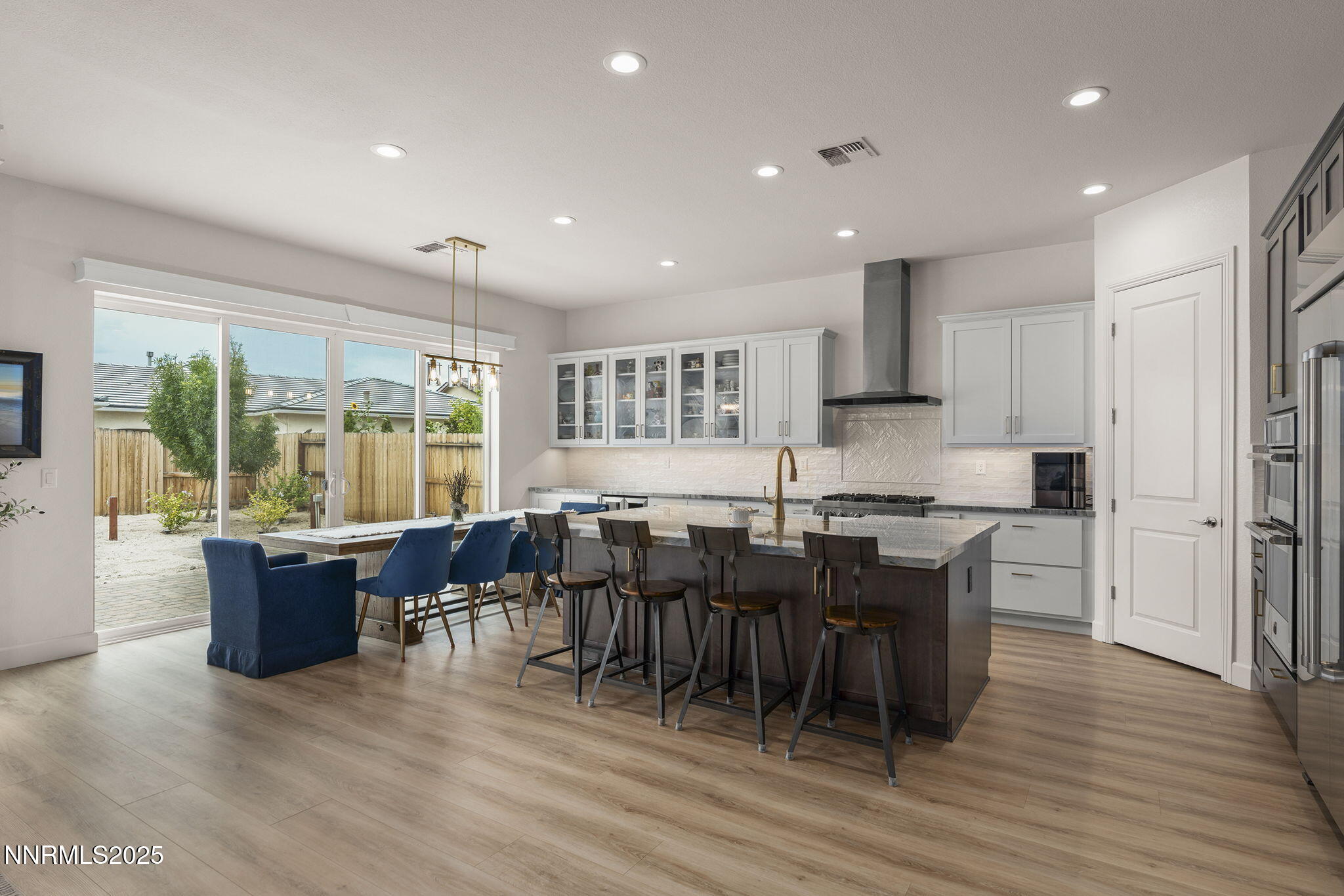 2310 Stone Rise Road Reno, NV 89521 - Photo 11 of 28 a view of a dining room with furniture window and wooden floor