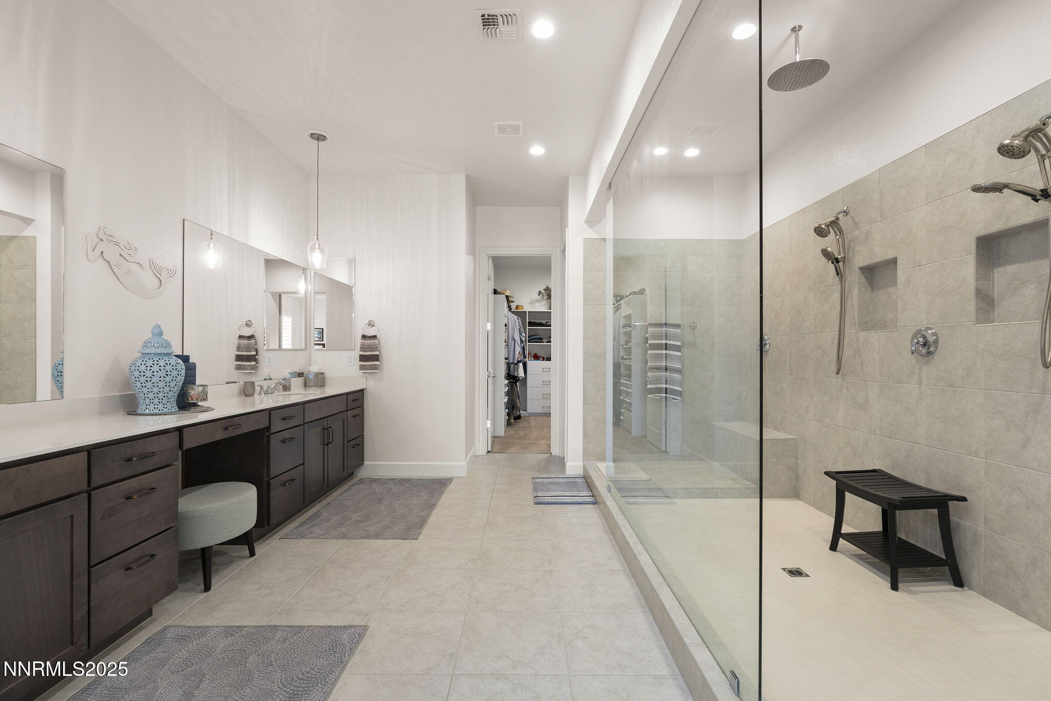 2310 Stone Rise Road Reno, NV 89521 - Photo 14 of 28 a large bathroom with a glass door shower sink and mirror