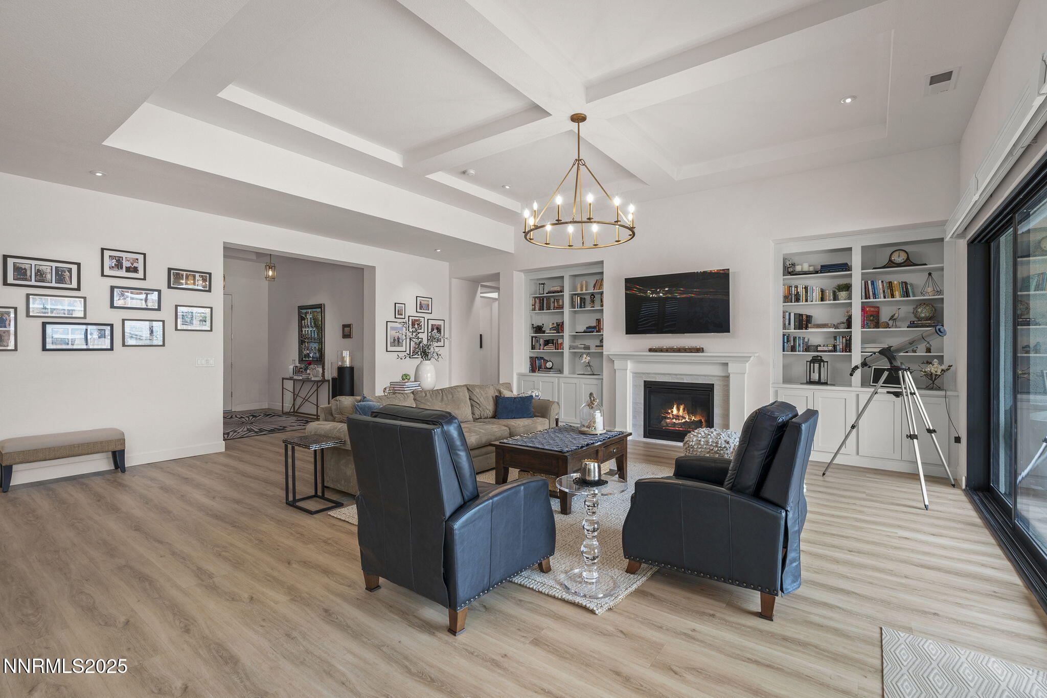 2310 Stone Rise Road Reno, NV 89521 - Photo 5 of 28 a living room with furniture a fireplace and a chandelier