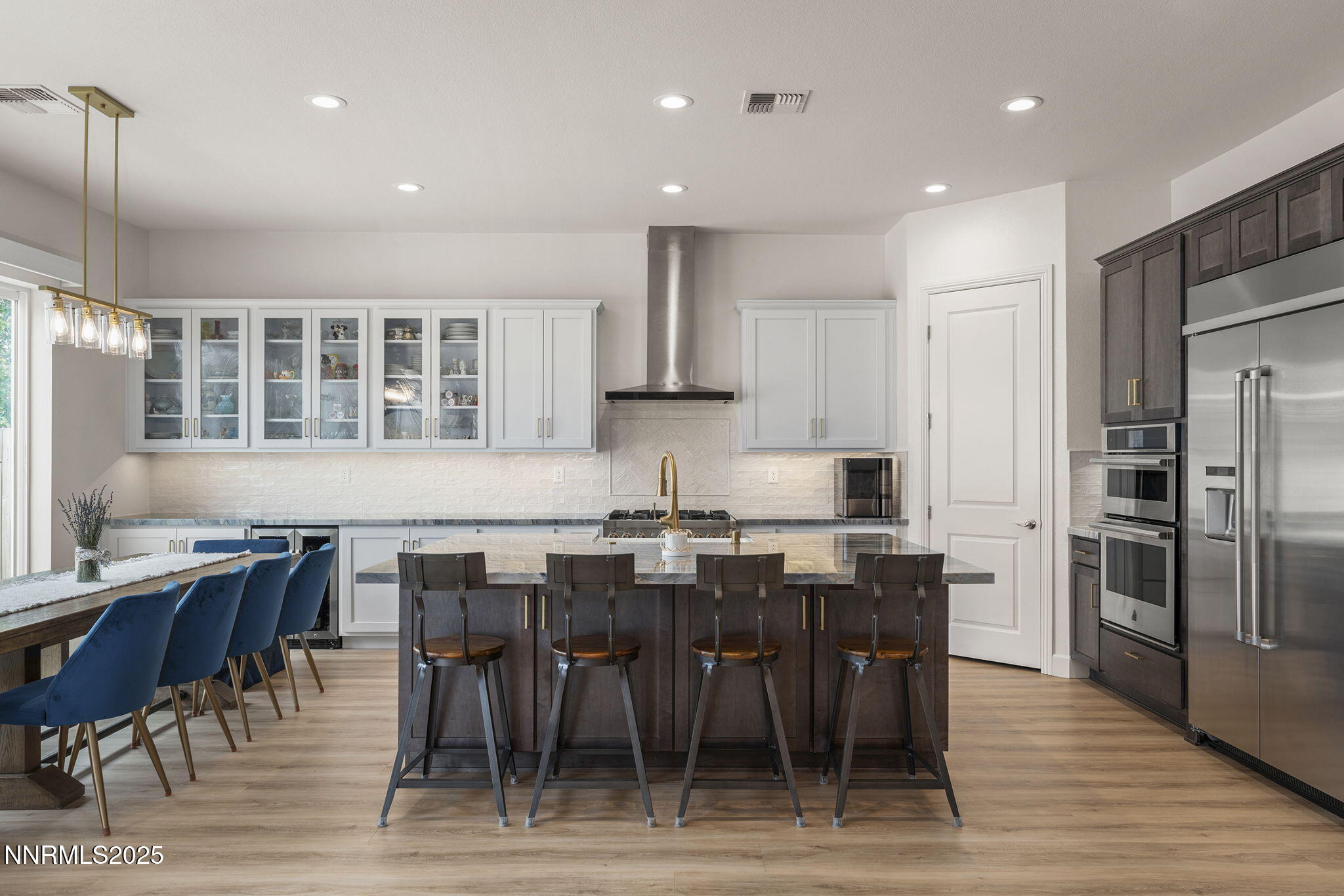 2310 Stone Rise Road Reno, NV 89521 - Photo 7 of 28 a view of a dining room with furniture wooden floor and kitchen view