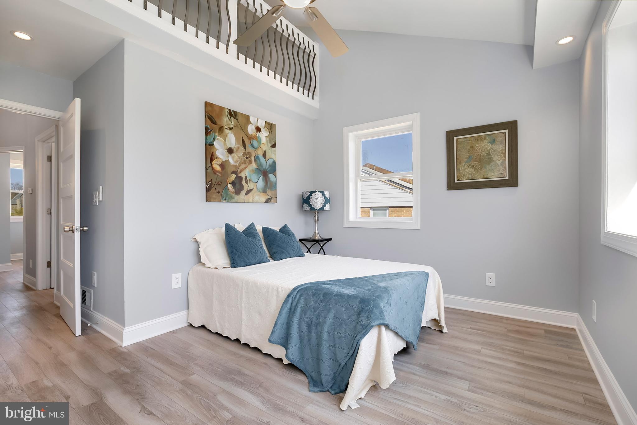 4822 Sargent Road Northeast Washington, DC 20017 - Photo 14 of 30 a bedroom with a bed and a painting on the wall