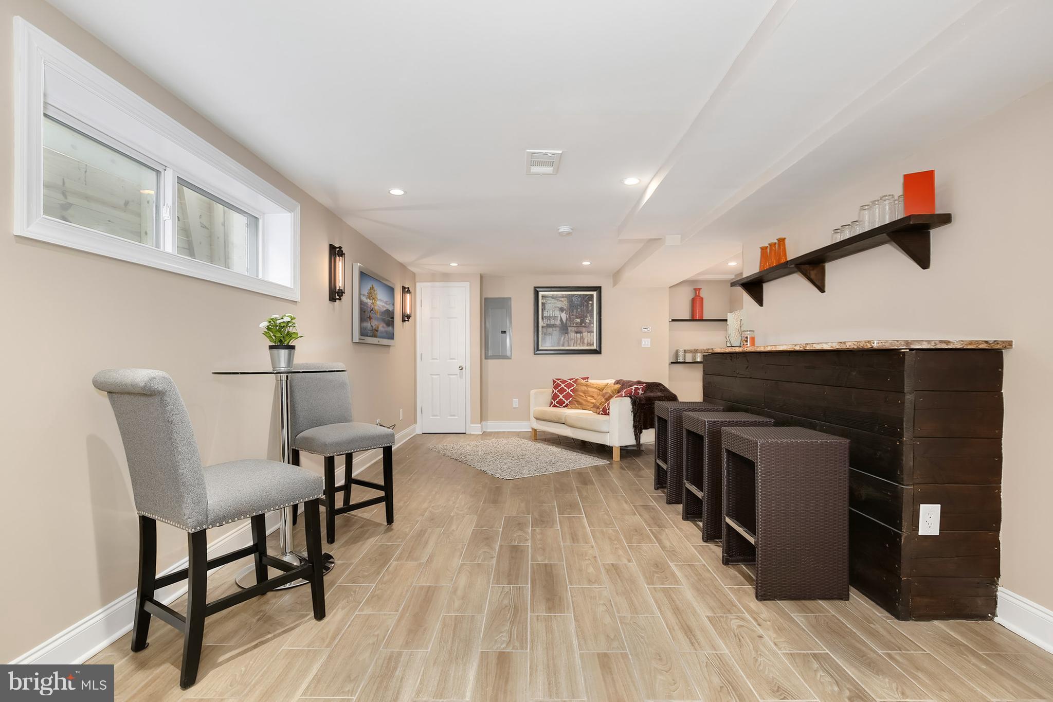 4822 Sargent Road Northeast Washington, DC 20017 - Photo 23 of 30 a living room with furniture and a wooden floor