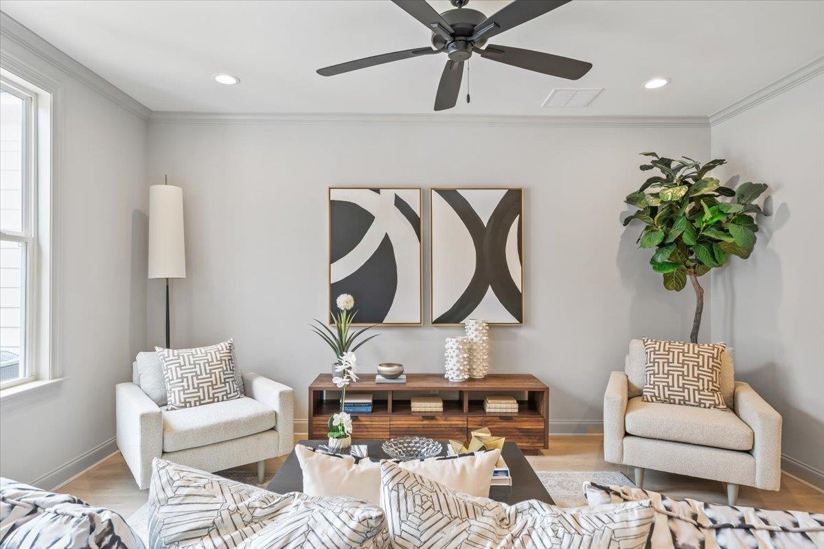 926 Aldwick Drive Collierville, TN 38017 - Photo 12 of 39 a living room with furniture and a potted plant