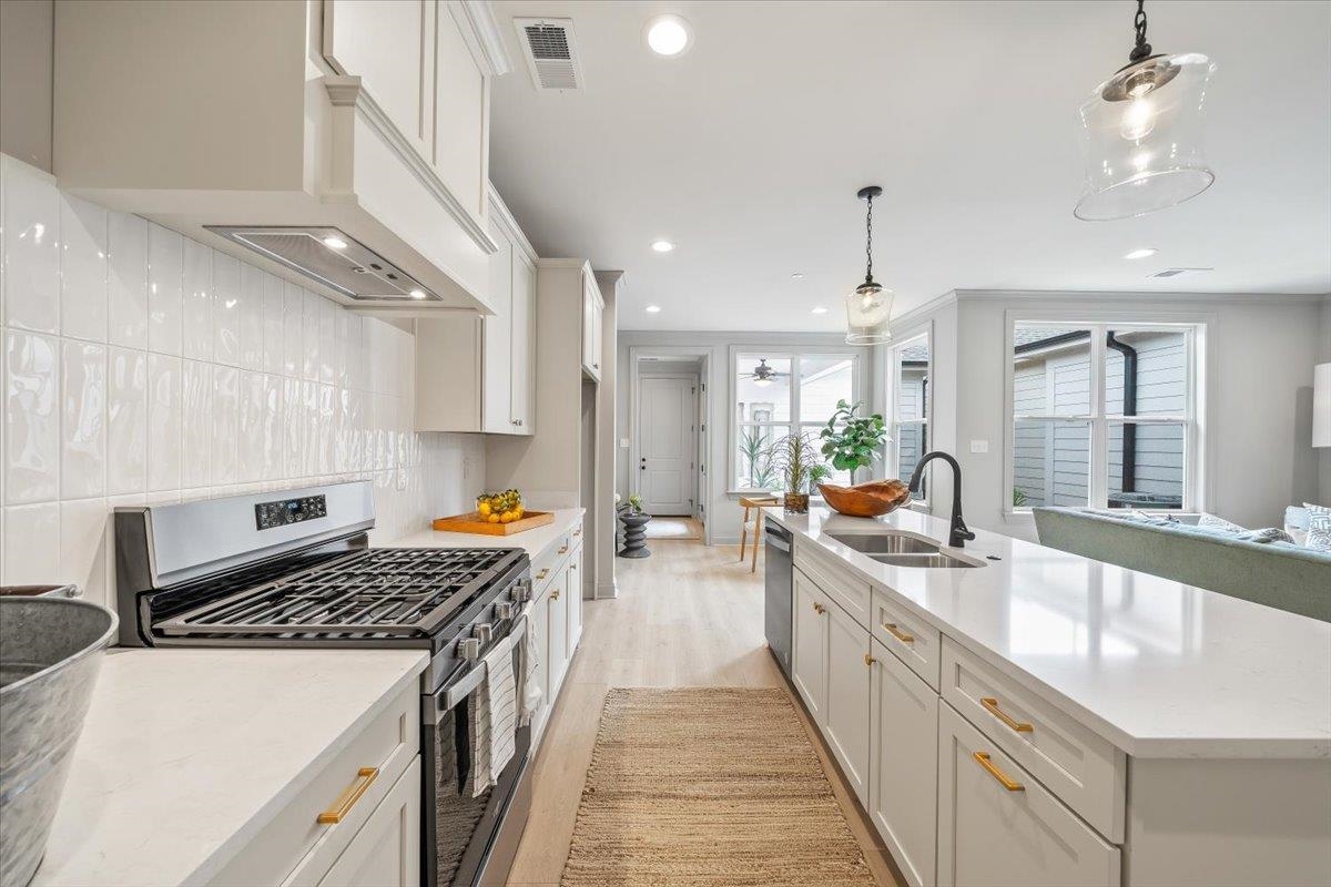 926 Aldwick Drive Collierville, TN 38017 - Photo 16 of 39 a large kitchen with stainless steel appliances granite countertop a lot of counter space and a sink