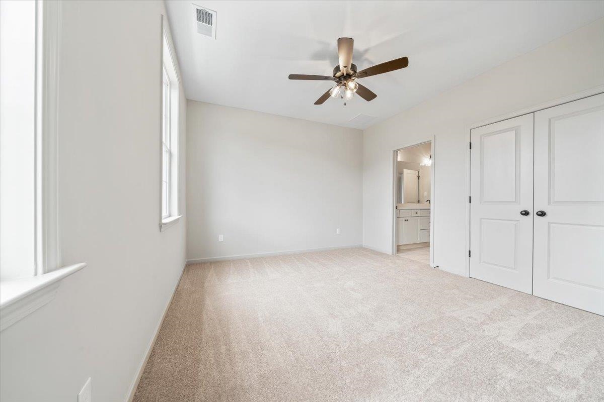 926 Aldwick Drive Collierville, TN 38017 - Photo 24 of 39 a view of a livingroom with a ceiling fan and window