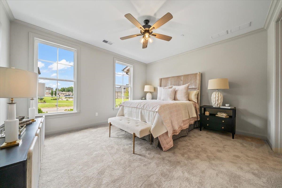 926 Aldwick Drive Collierville, TN 38017 - Photo 5 of 39 a spacious bedroom with a bed and a table in it