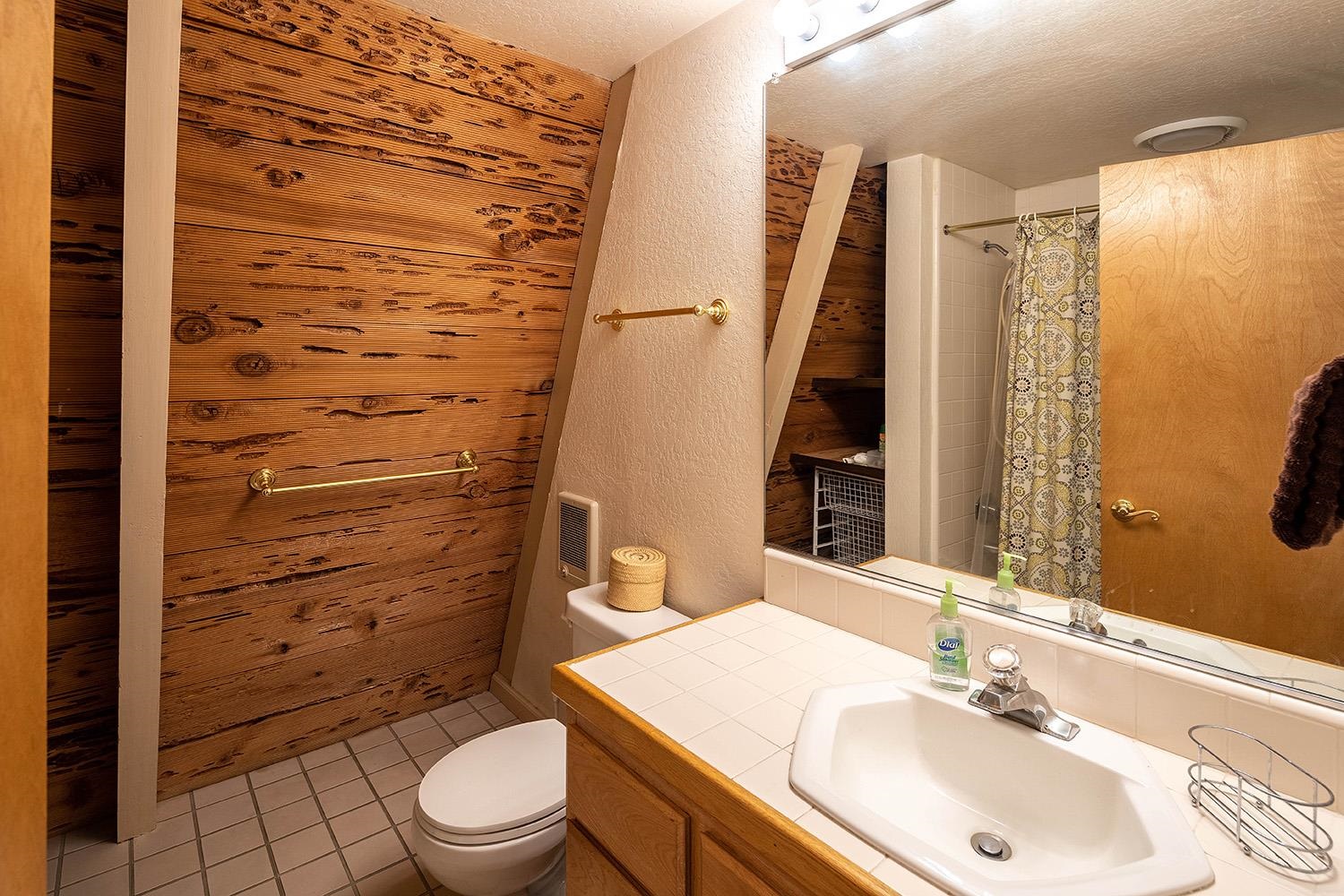 1281 Sandy Way Olympic Valley, CA 96146 - Photo 18 of 19 a bathroom with a sink a toilet and shower