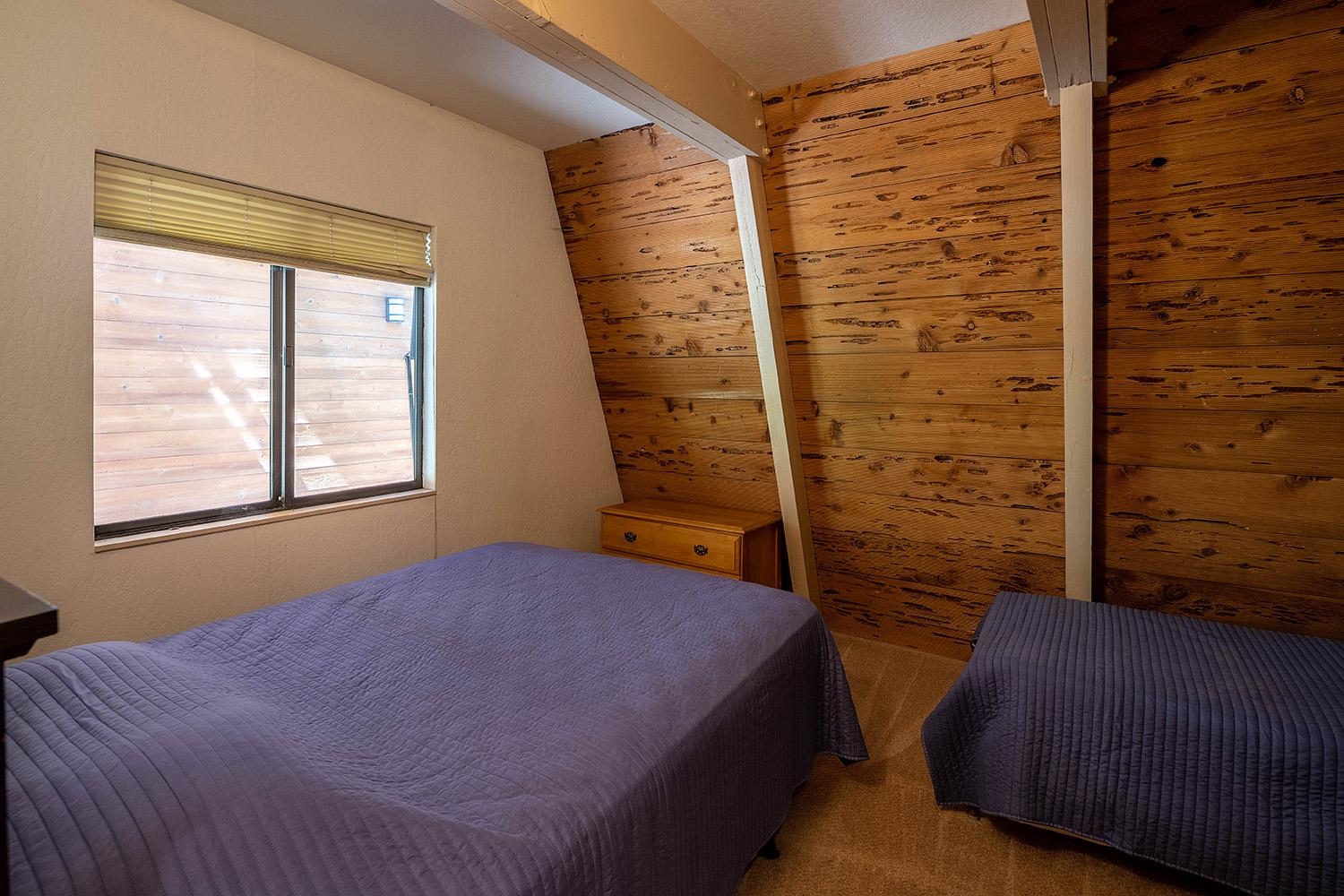 1281 Sandy Way Olympic Valley, CA 96146 - Photo 19 of 19 a bedroom with a bed and a window