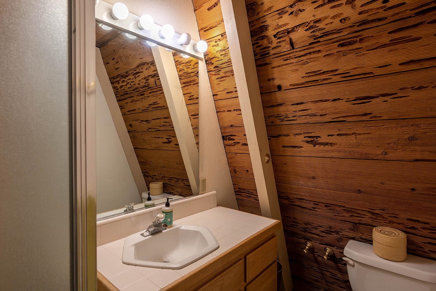 1281 Sandy Way Olympic Valley, CA 96146 - Photo 8 of 19 a bathroom with a sink and a mirror