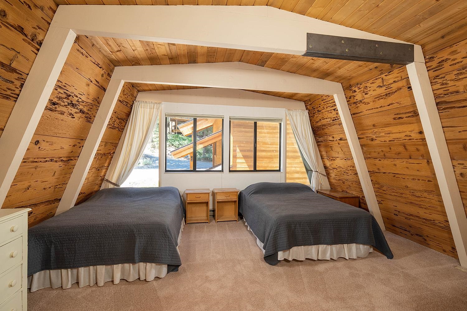 1281 Sandy Way Olympic Valley, CA 96146 - Photo 9 of 19 a bedroom with a bed and a large window