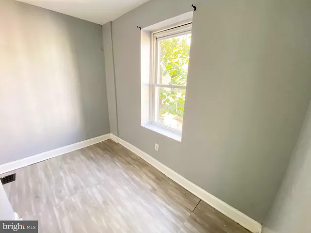a view of an empty room and a window
