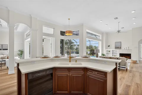 a kitchen with a sink stove and cabinets