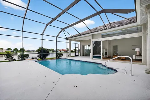 a view of a swimming pool with a patio