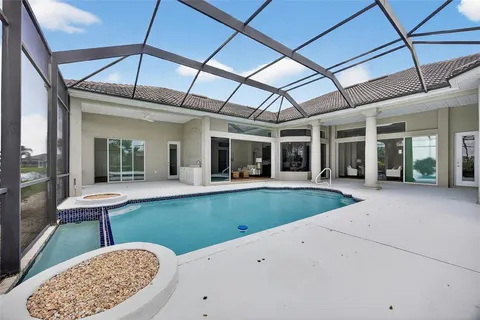 a view of a patio with table and chairs and potted plants