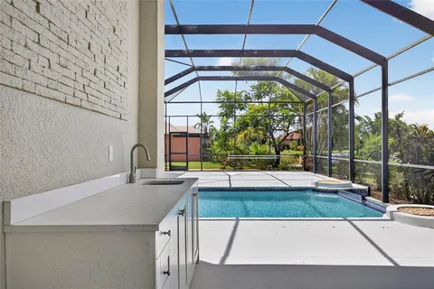 a view of swimming pool with outdoor seating