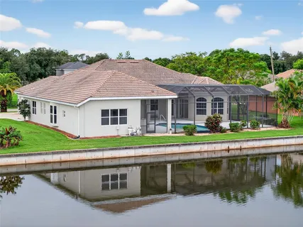 a aerial view of a house with a yard