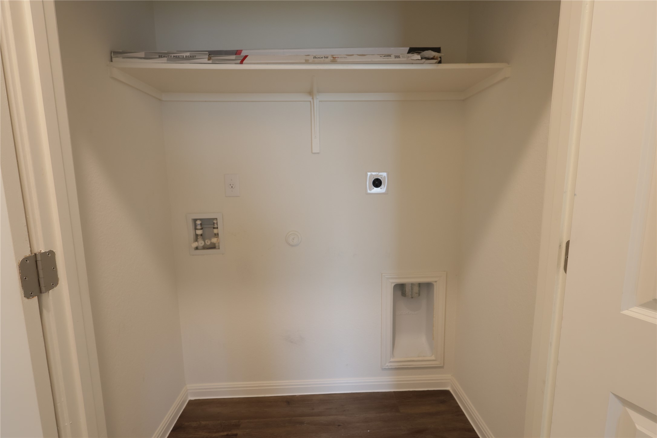 250 Seneca Loop Kyle, TX 78640 - Photo 10 of 22 A dedicated laundry closet offers convenient hookups and overhead storage for household essentials.