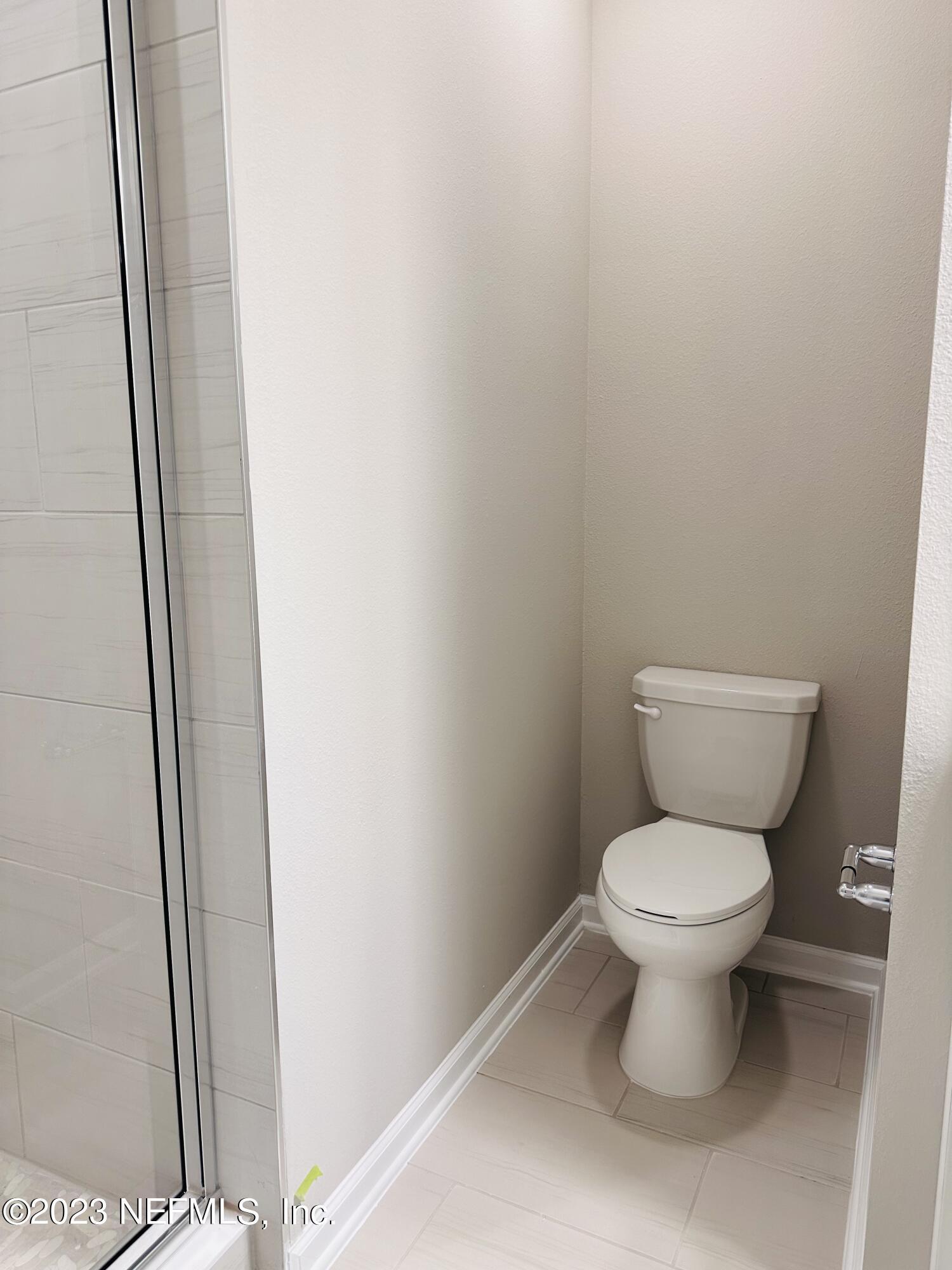 69 Thurnham Lane St. Augustine, FL 32092 - Photo 8 of 10 a white toilet sitting next to a shower