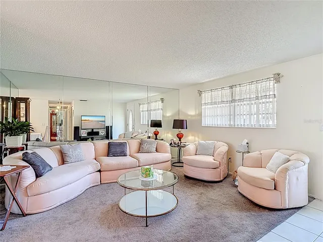 a kitchen with stainless steel appliances granite countertop a sink and a white cabinets