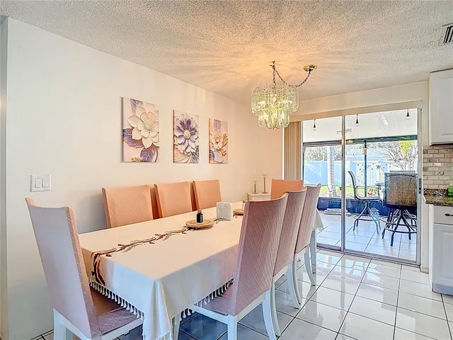 a kitchen with stainless steel appliances a refrigerator sink and cabinets