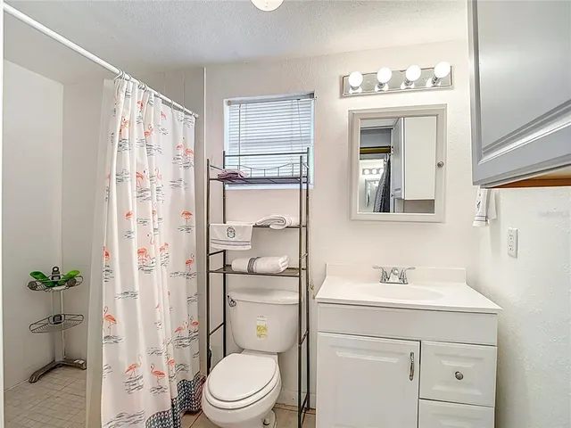 a front view of a house with a yard garage and outdoor seating