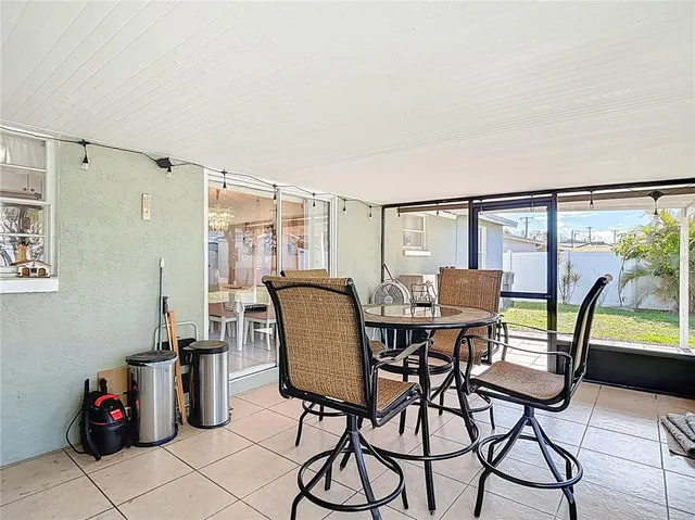a view of swimming pool with outdoor seating