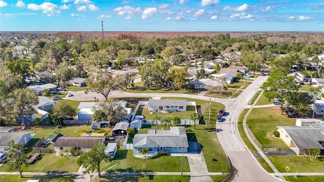 a front view of house with a garden and patio