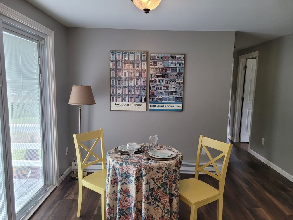 416 Southampton Road Holyoke, MA 01040 - Photo 5 of 12 a view of a dining room with furniture and wooden floor