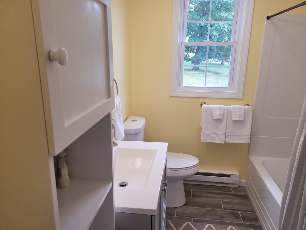 416 Southampton Road Holyoke, MA 01040 - Photo 9 of 12 a bathroom with a sink and toilet