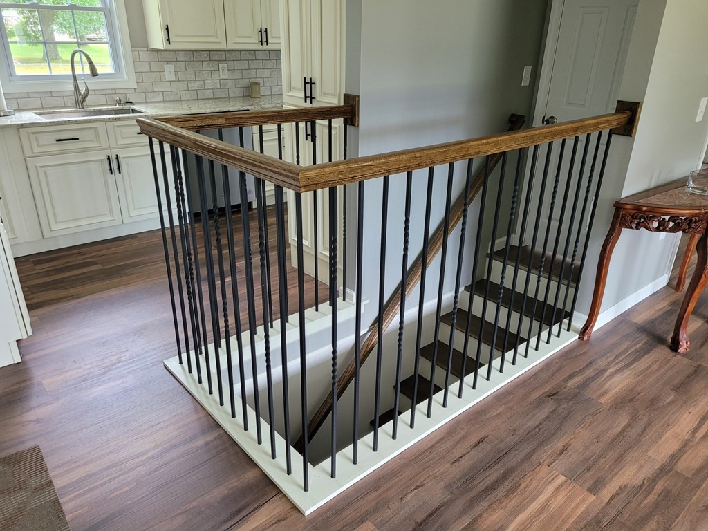 416 Southampton Road Holyoke, MA 01040 - Photo 10 of 12 a view of staircase with railing and a wooden floor