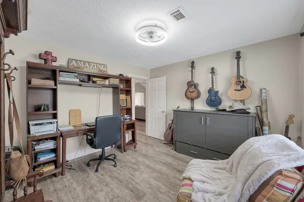 a bedroom with furniture and a window