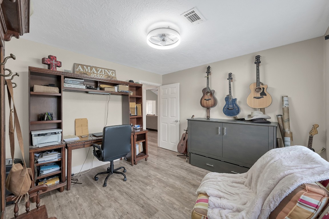 8 Cambridge Road Conroe, TX 77304 - Photo 31 of 44 a view of a livingroom with workspace and a window