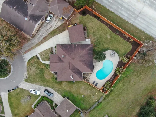 an aerial view of a house with outdoor space